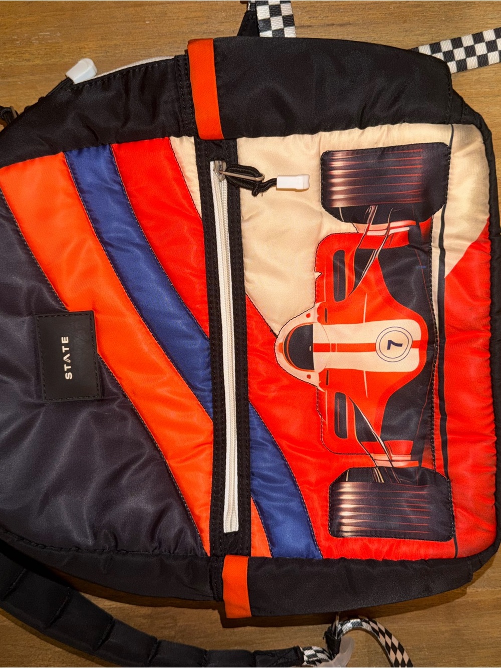1. State Quilted Racing Laptop Bag in Red, Blue, Black, Cream